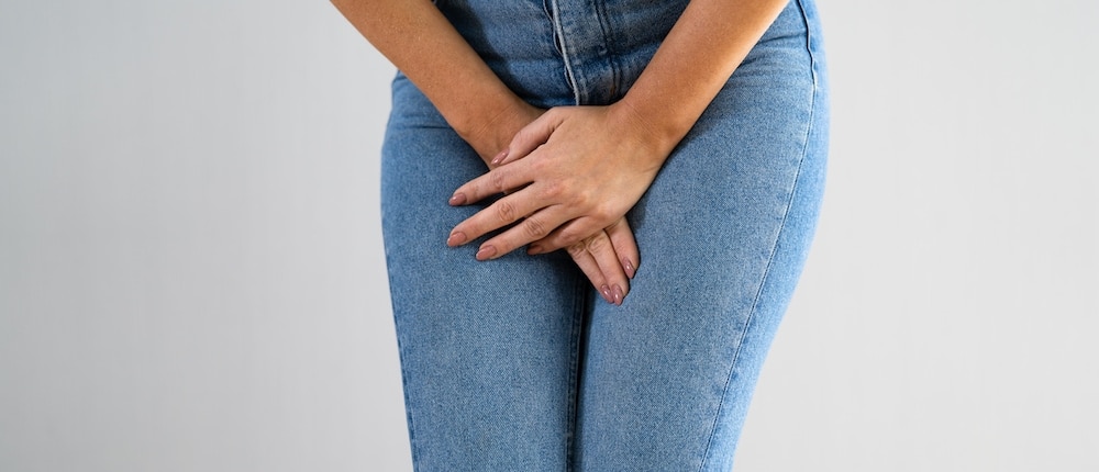 Bowel Incontinence Pain. Woman Hand Holding Crotch